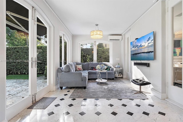 living area featuring a wall mounted air conditioner, french doors, baseboards, and ornamental molding