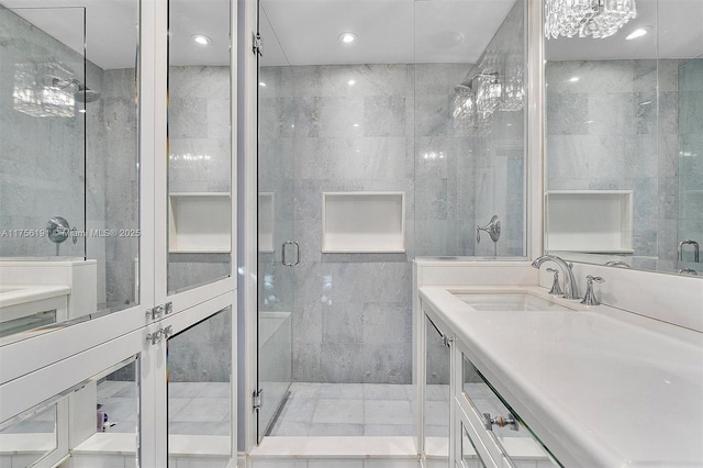 full bath featuring recessed lighting, a stall shower, vanity, and tile walls