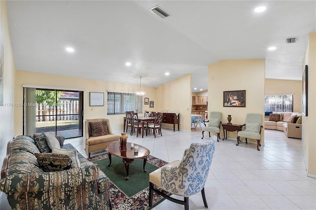 living area featuring light tile patterned floors, visible vents, recessed lighting, and vaulted ceiling