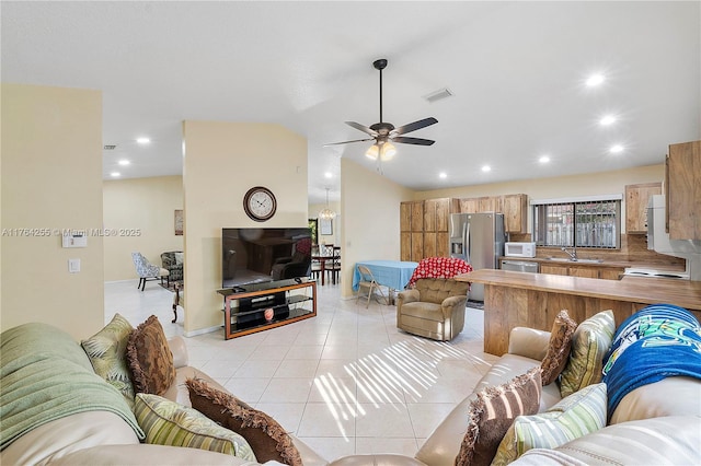 living room with visible vents, recessed lighting, light tile patterned flooring, ceiling fan, and vaulted ceiling