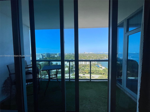 balcony with a view of city and a water view