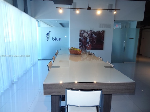 unfurnished dining area featuring tile patterned floors and visible vents