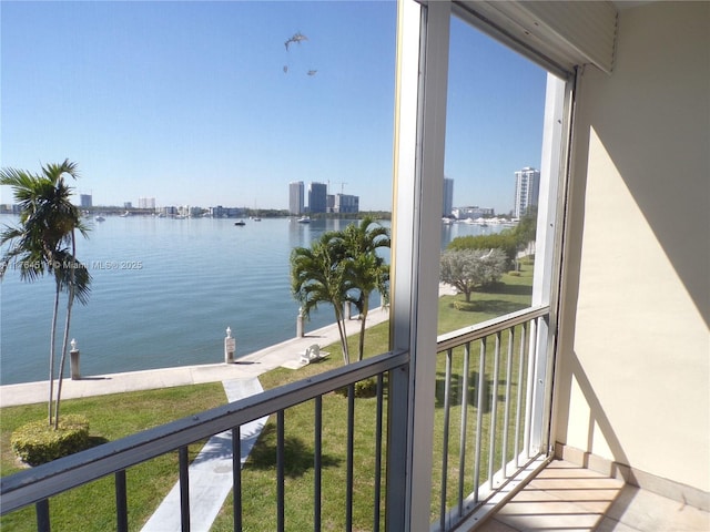 balcony with a view of city and a water view