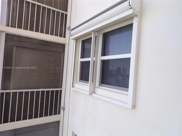 doorway to property with stucco siding