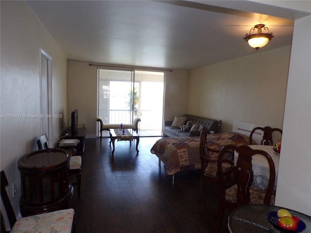 bedroom with dark wood finished floors