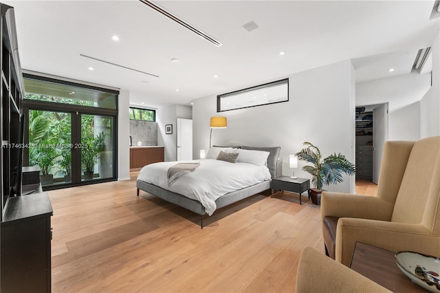 bedroom featuring recessed lighting and light wood finished floors