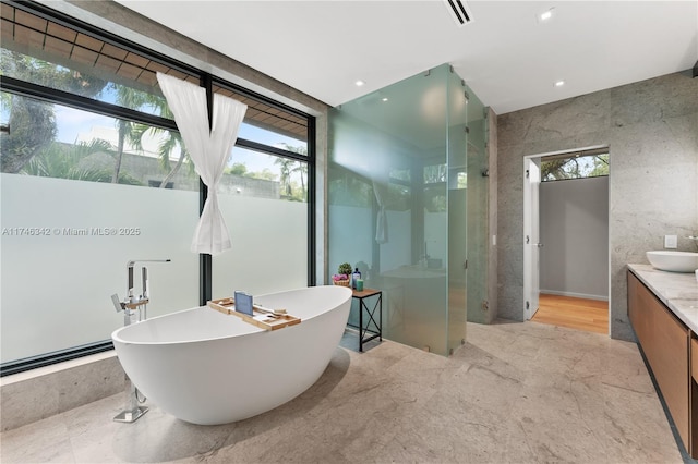 2803 Crystal Ct, Coconut Grove, FL 33133 - full bath featuring a shower stall, a freestanding bath, vanity, and expansive windows