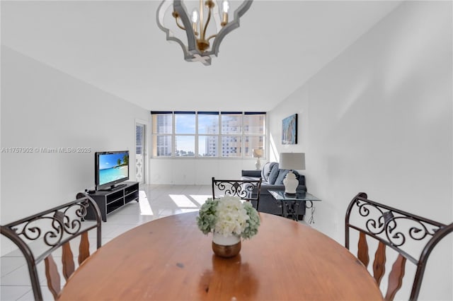 dining space featuring a chandelier and tile patterned floors