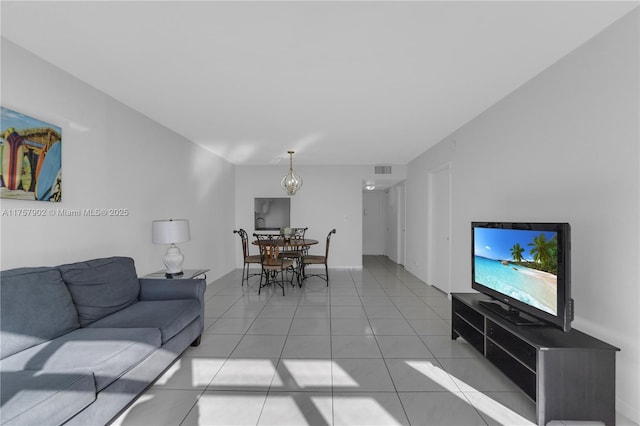 living room with light tile patterned flooring and visible vents