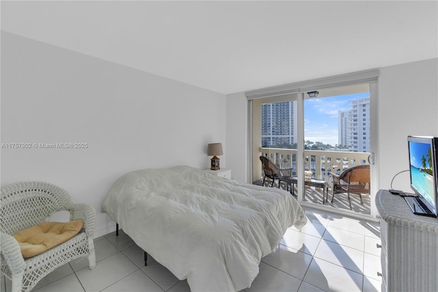 tiled bedroom with expansive windows