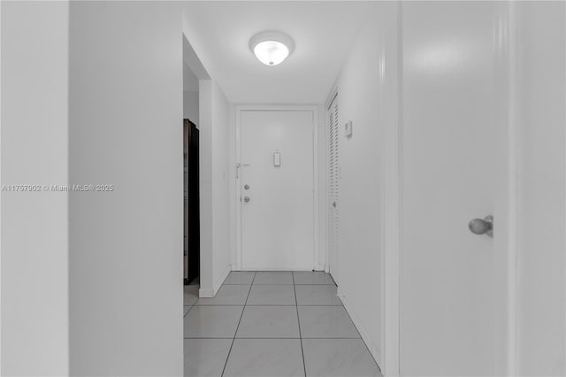 hallway with light tile patterned floors