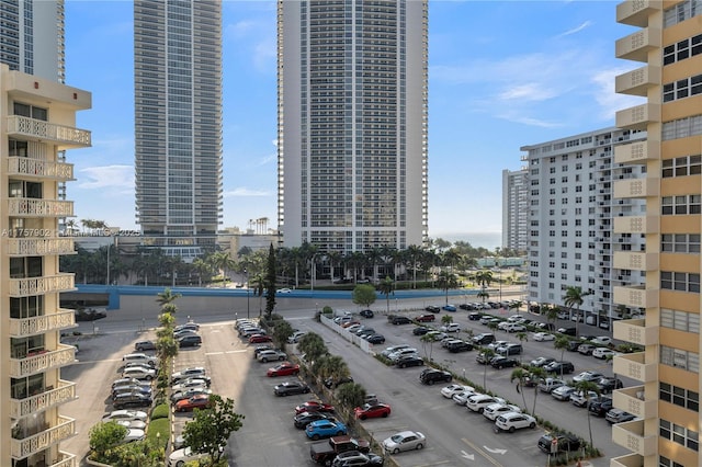 exterior space with a view of city and uncovered parking