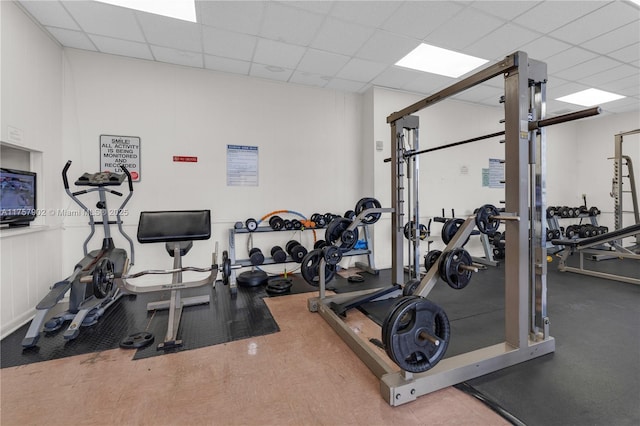 exercise room with a drop ceiling