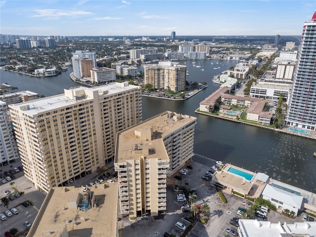 bird's eye view featuring a water view and a city view