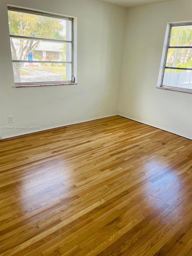 empty room with wood finished floors