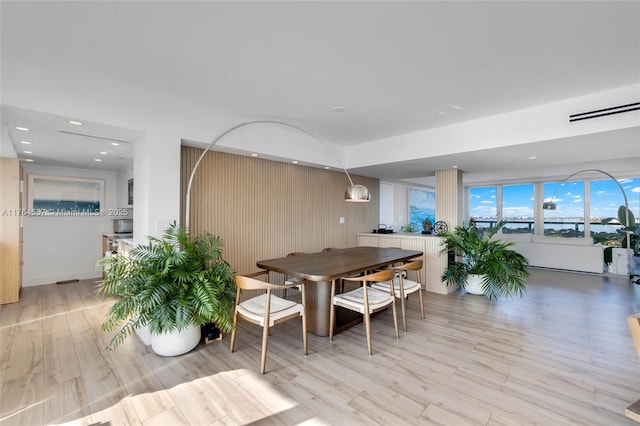 dining room featuring recessed lighting and light wood-type flooring