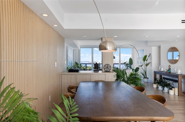 dining room with recessed lighting and wood finished floors