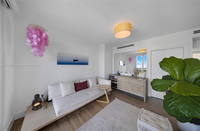 living area with wood finished floors