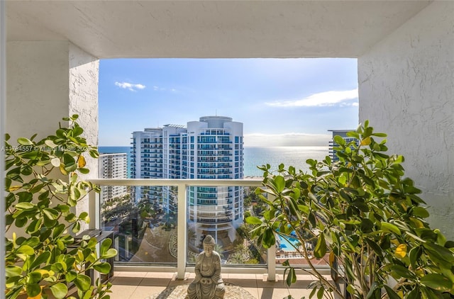 balcony with a city view and a water view