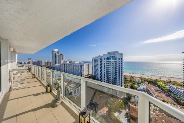 balcony with a view of city and a water view