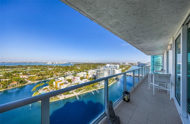 balcony with a city view and a water view