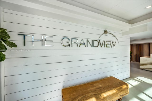 mudroom featuring wooden walls