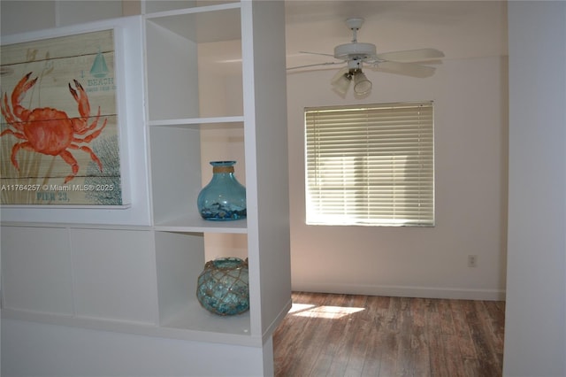 interior details with wood finished floors, baseboards, and ceiling fan