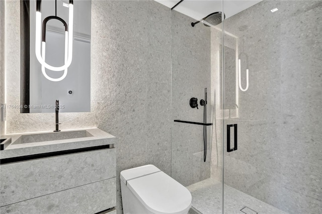 bathroom featuring toilet, tile walls, a stall shower, and vanity