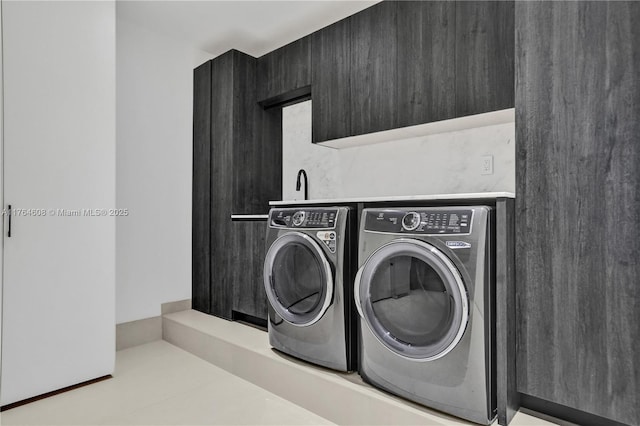 laundry room with laundry area and washing machine and clothes dryer