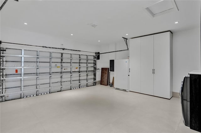 3234 SW 53rd Ct, Hollywood, FL 33312 - garage featuring recessed lighting, electric panel, and freestanding refrigerator