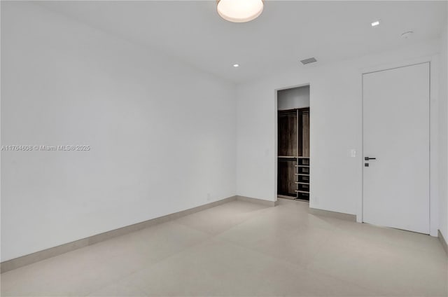 unfurnished room featuring light tile patterned floors, visible vents, recessed lighting, and baseboards