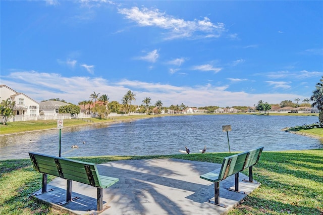 exterior space featuring a yard and a water view