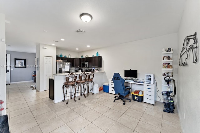 office area featuring light tile patterned floors, visible vents, recessed lighting, and baseboards