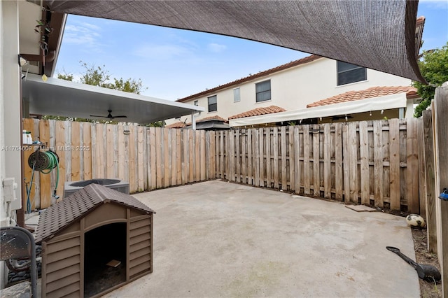 view of patio with central air condition unit, a fenced backyard, and ceiling fan