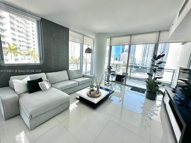 living room with floor to ceiling windows