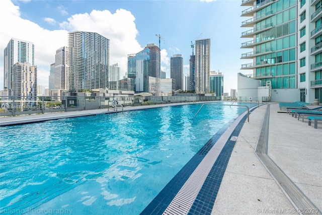 view of pool featuring a city view