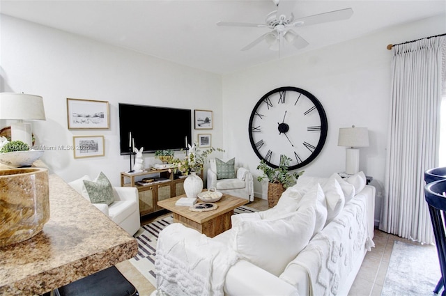 living room featuring tile patterned floors and ceiling fan