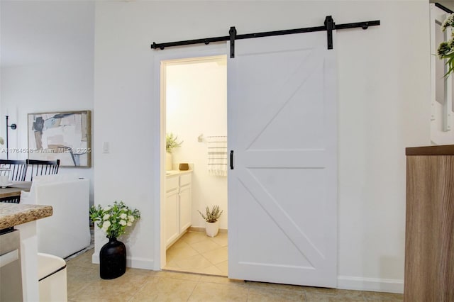 bathroom featuring baseboards, vanity, and tile patterned flooring