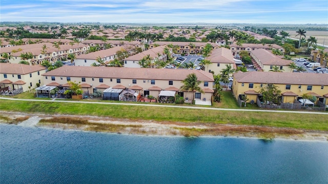 aerial view with a residential view and a water view