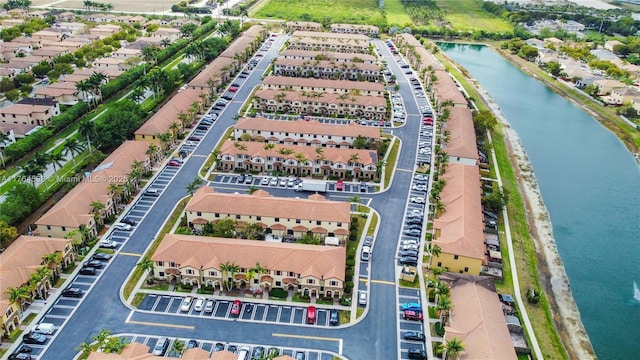 aerial view with a residential view and a water view