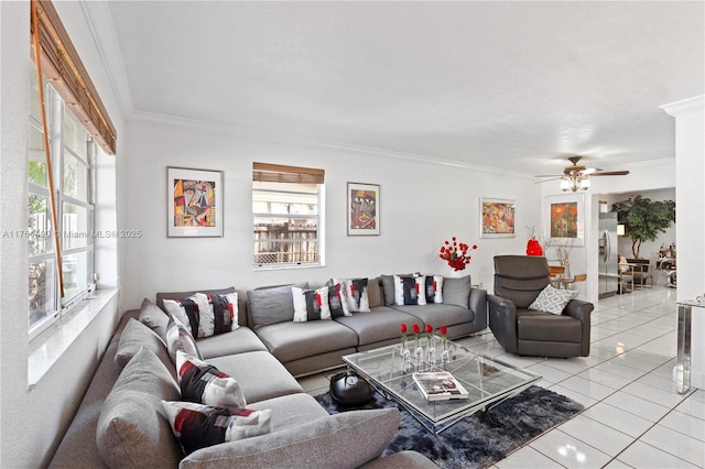 living room with light tile patterned floors, ceiling fan, and ornamental molding