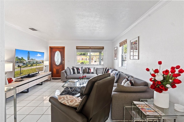 living room with ornamental molding, light tile patterned floors, visible vents, and a textured ceiling