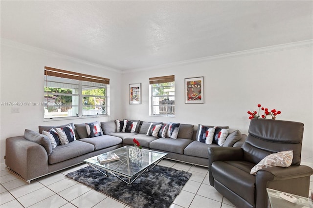 living area featuring light tile patterned floors, a textured ceiling, and ornamental molding