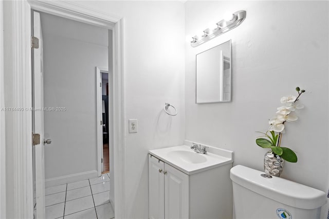 bathroom with tile patterned floors, toilet, and vanity