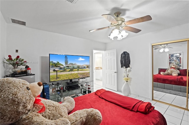 bedroom featuring visible vents, a ceiling fan, and tile patterned flooring