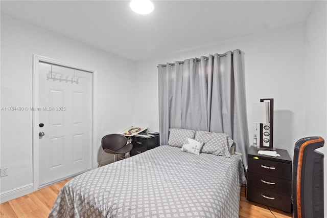 bedroom with light wood-style floors