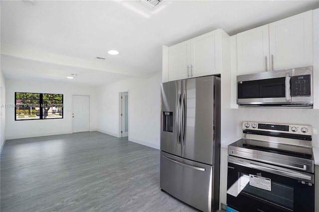 kitchen with white cabinetry, baseboards, light wood finished floors, and stainless steel appliances