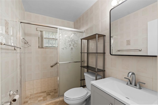 bathroom with toilet, a stall shower, tasteful backsplash, tile walls, and vanity