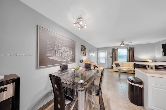 dining room featuring light tile patterned floors and a ceiling fan