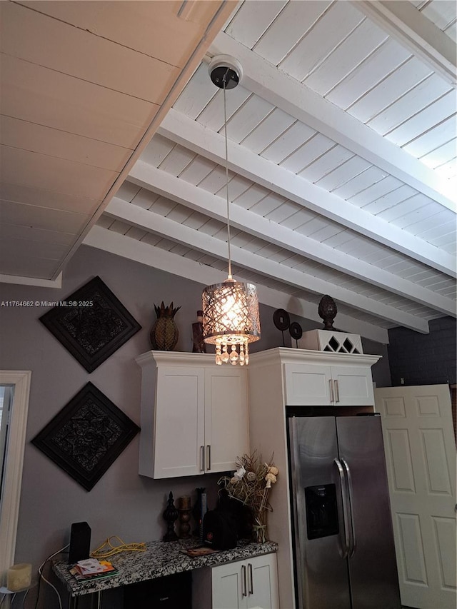 911 W Country Club Cir, Plantation, FL 33317 - kitchen with beamed ceiling, white cabinets, dark stone counters, and stainless steel fridge with ice dispenser